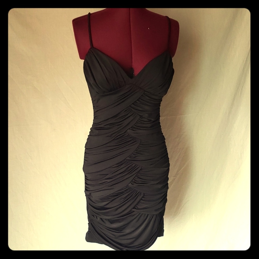 Black form fitting gathered cocktail dress